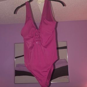 Plum one piece sexy low back bathing suit.